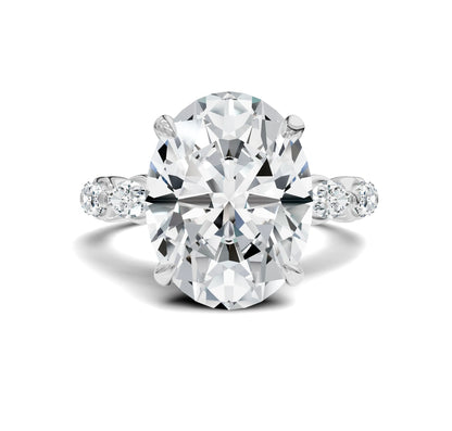 Diamond ring with a large central Oval Diamond and smaller stones