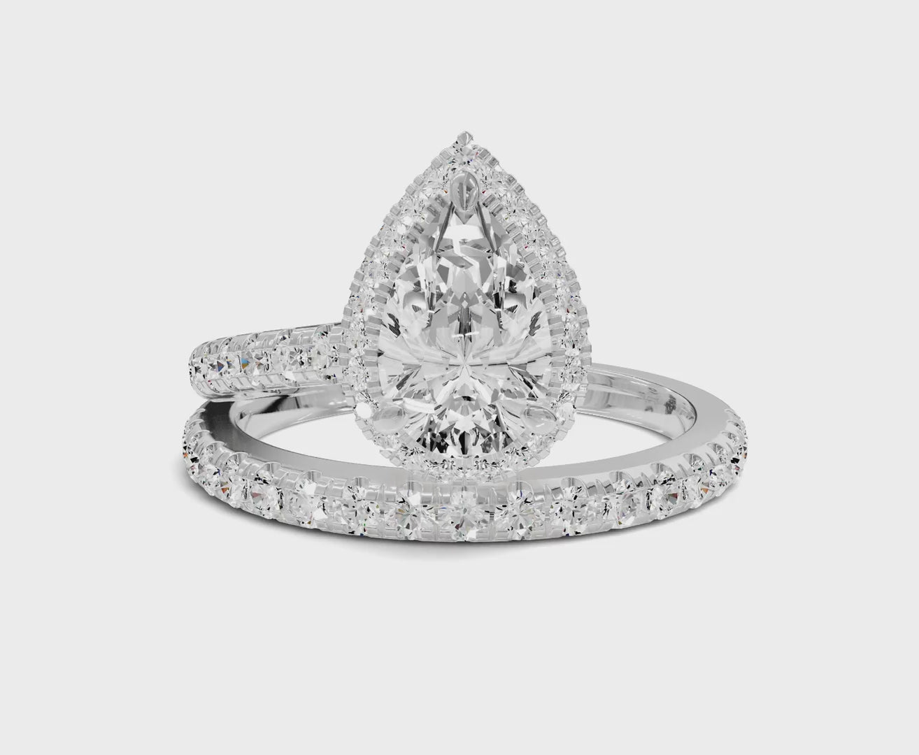 Pear Shaped Diamond Halo Engagement Ring with Side Stones